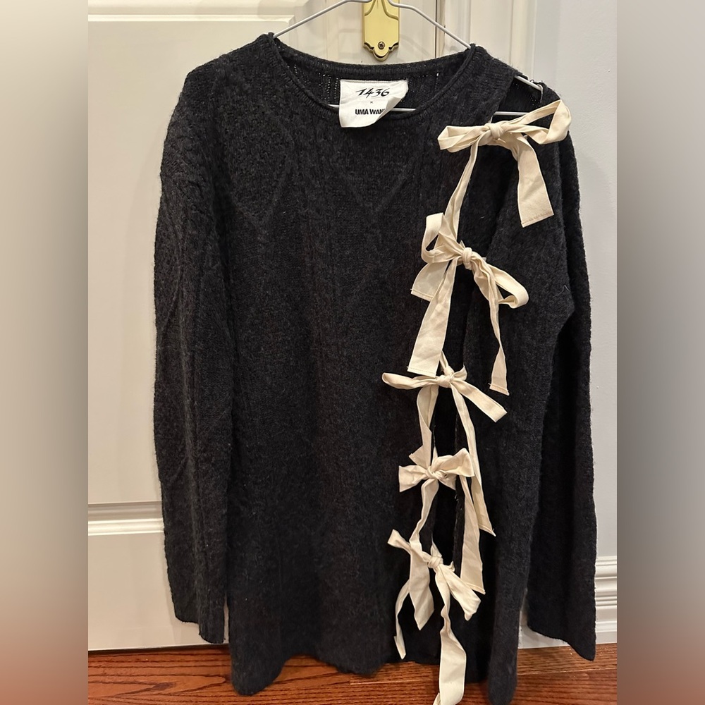 Designer sweater bow detail